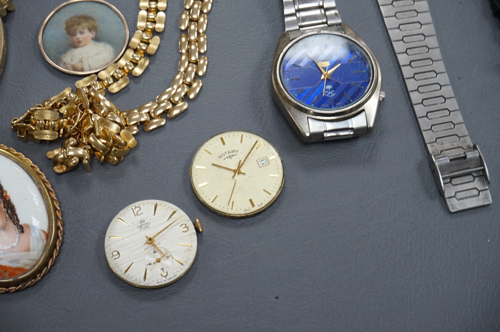 A quantity of assorted costume jewellery and other items including wrist watches, watch movements and a silver vesta case.